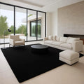 Minimalist Living Room Decor: Black Rug, Cream Sofa - Interior Design Inspiration
