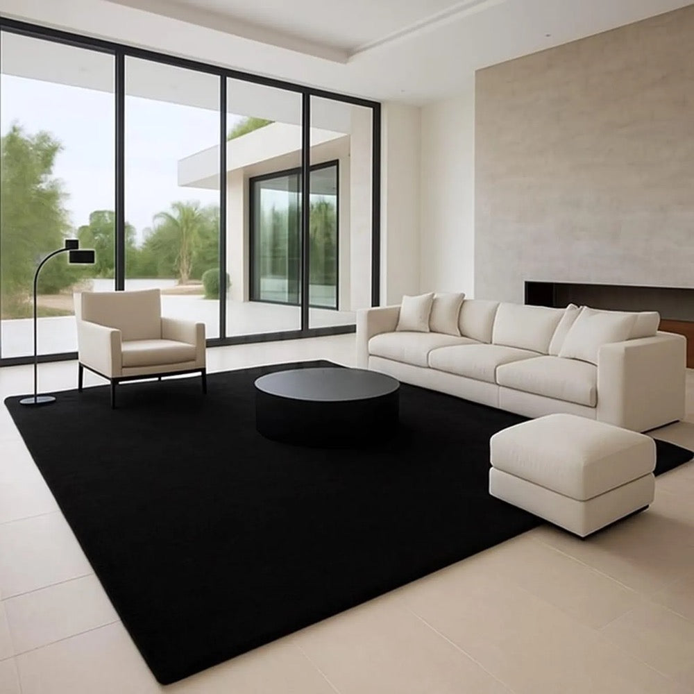 Minimalist Living Room Decor: Black Rug, Cream Sofa - Interior Design Inspiration